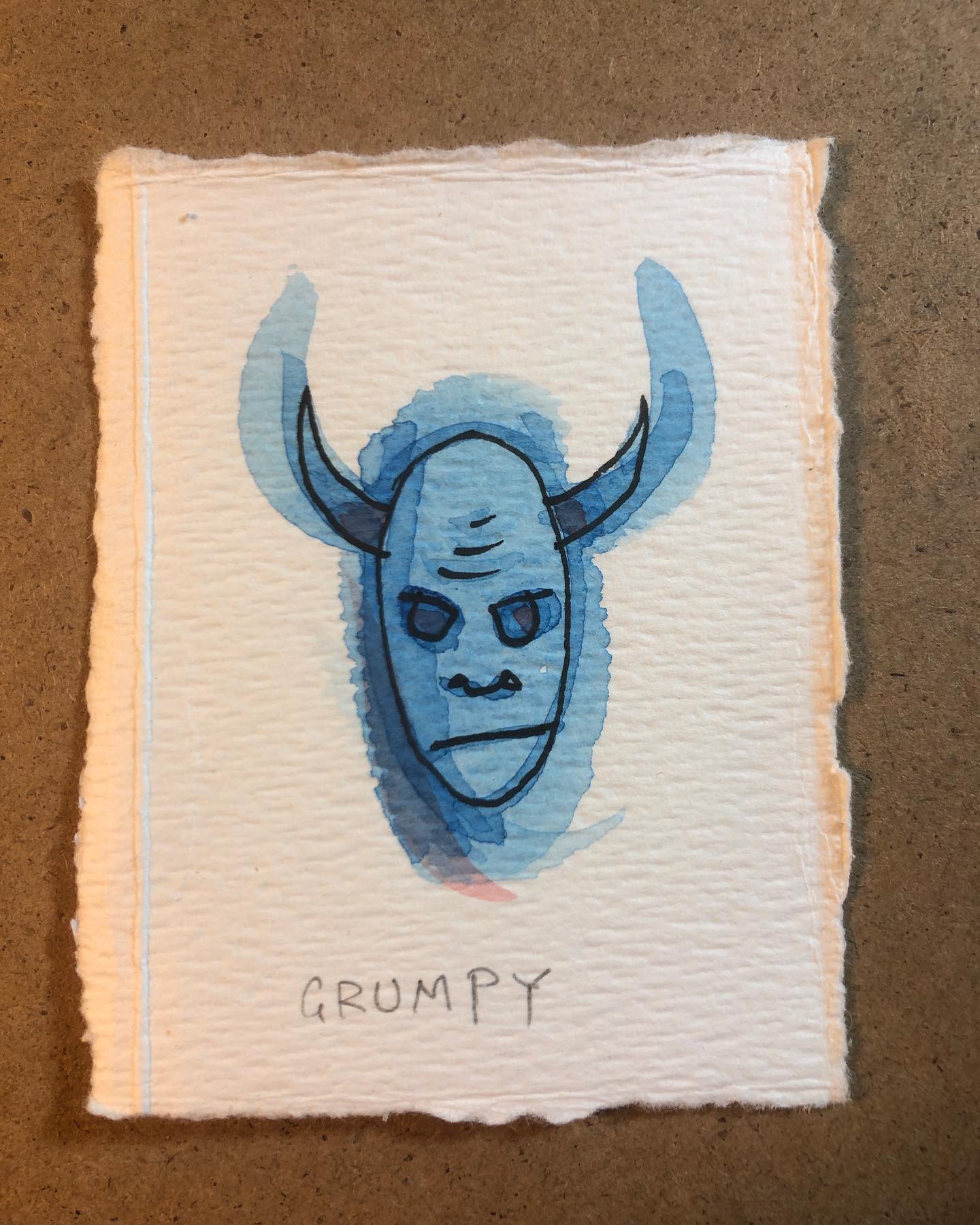 Watercolor and ink drawing of a grumpy looking demon with horns