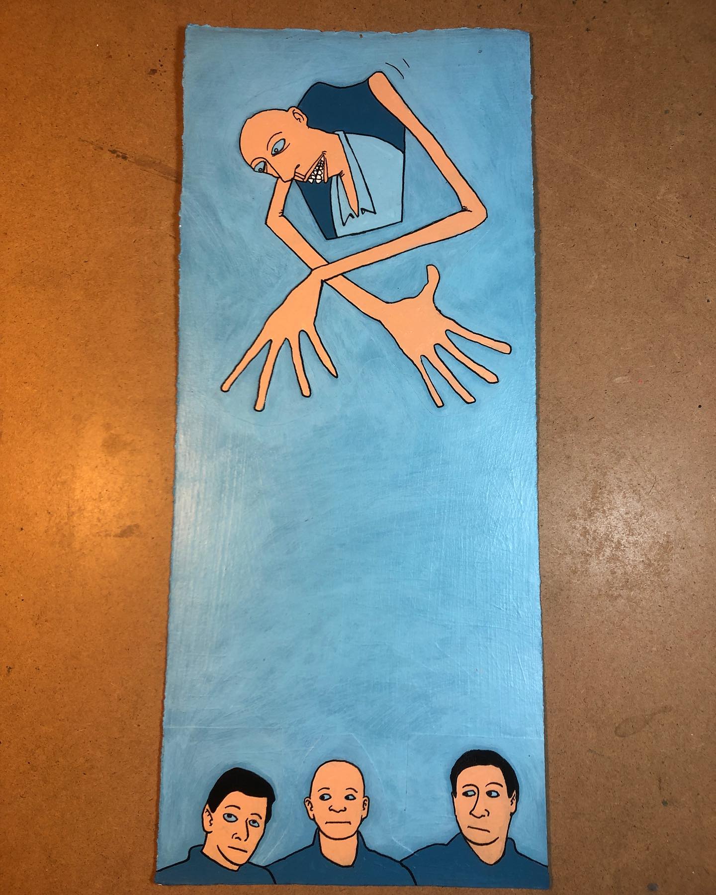 Blue painting of three heads at bottom and a hovering godlike character above on a light blue background.