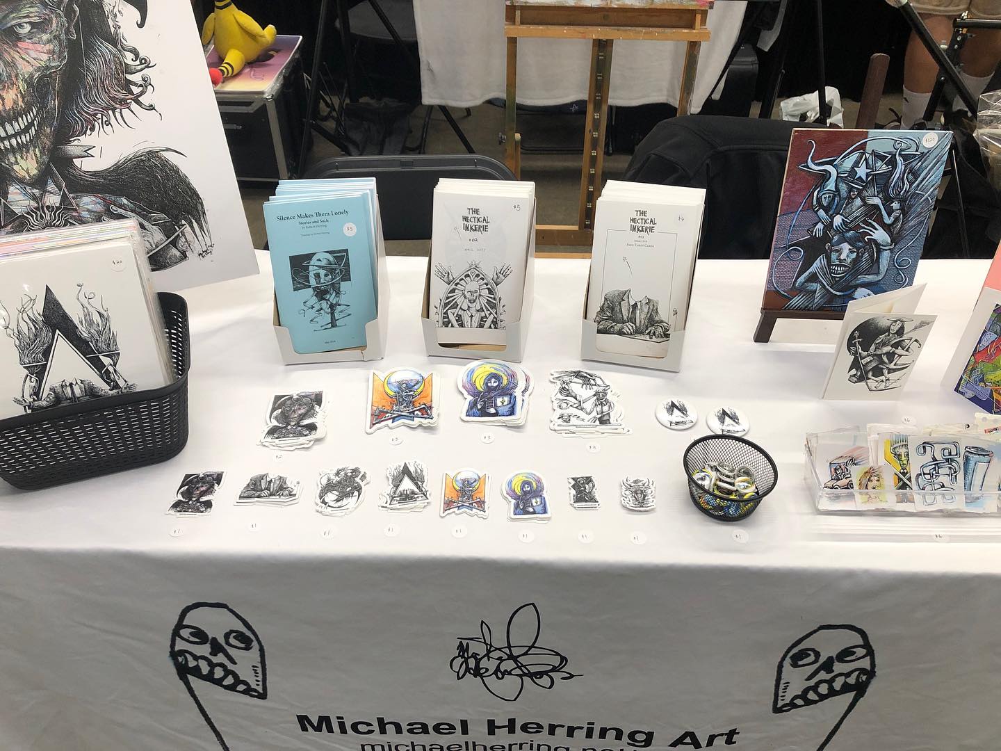 My table at GalaxyCon's Animate! Des Moines 2024 - Original art, prints, paintings, zines, and stickers